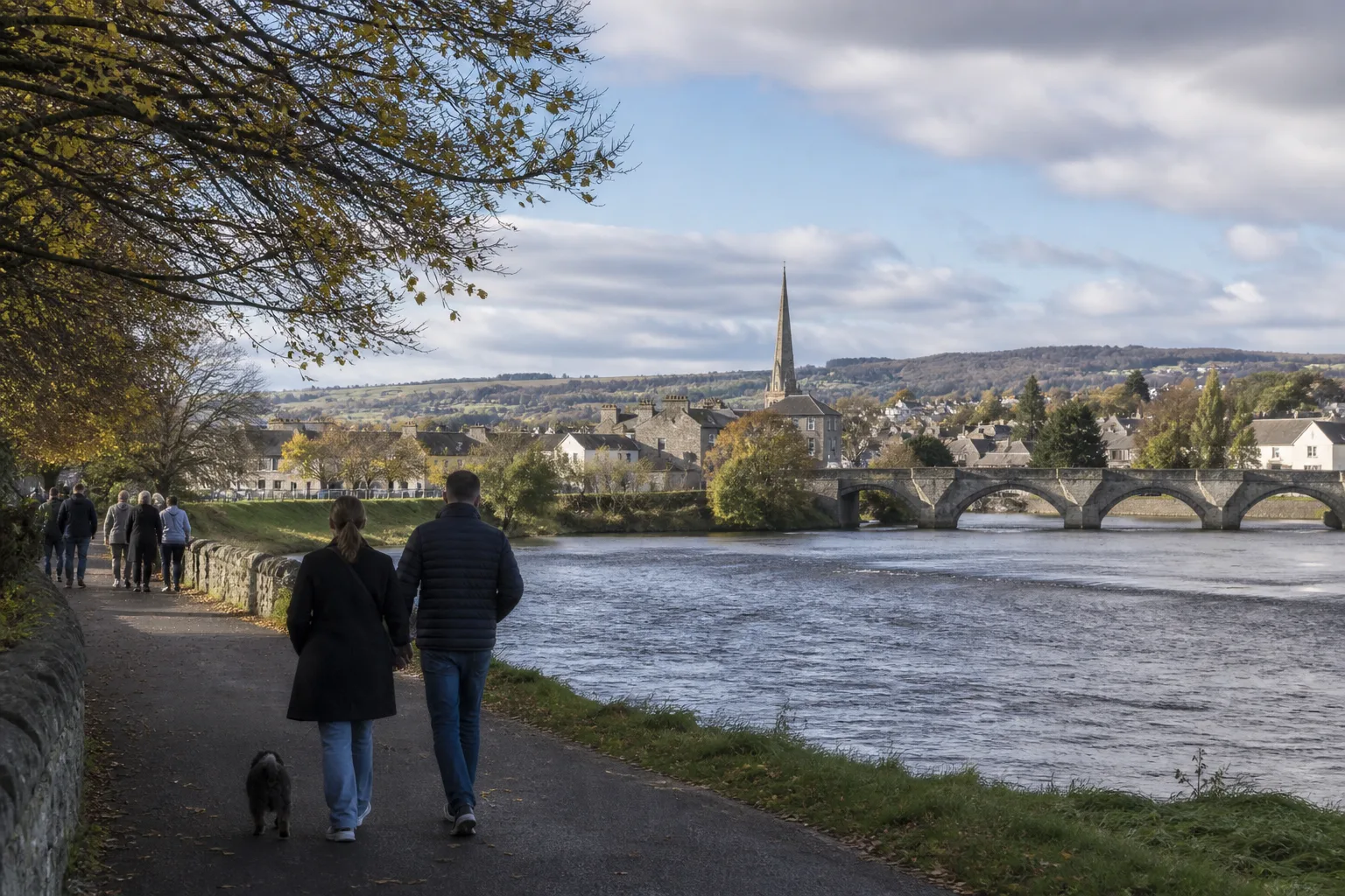 People talking beside the River Tay in Perth, Scotland
